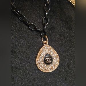 Elegant Gold and Black Teardrop Iconic Logo Pendant Necklace